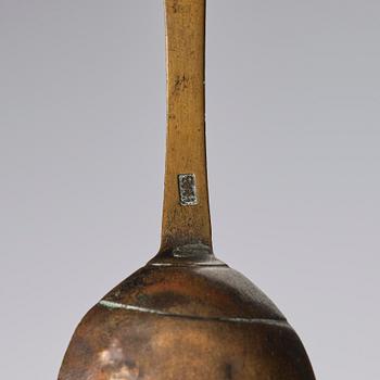 A set of three brass spoons, 18th century.