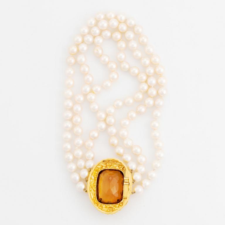 Three strand cultured pearl choker necklace, clasp 18K gold with large faceted cushion shaped citrine.