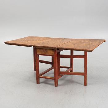 A 19th century gateleg table.