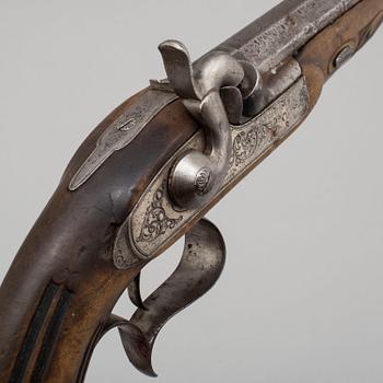 A pair of mid 19th century percussion pistols in a case marked Campagnac a Bordeaux.