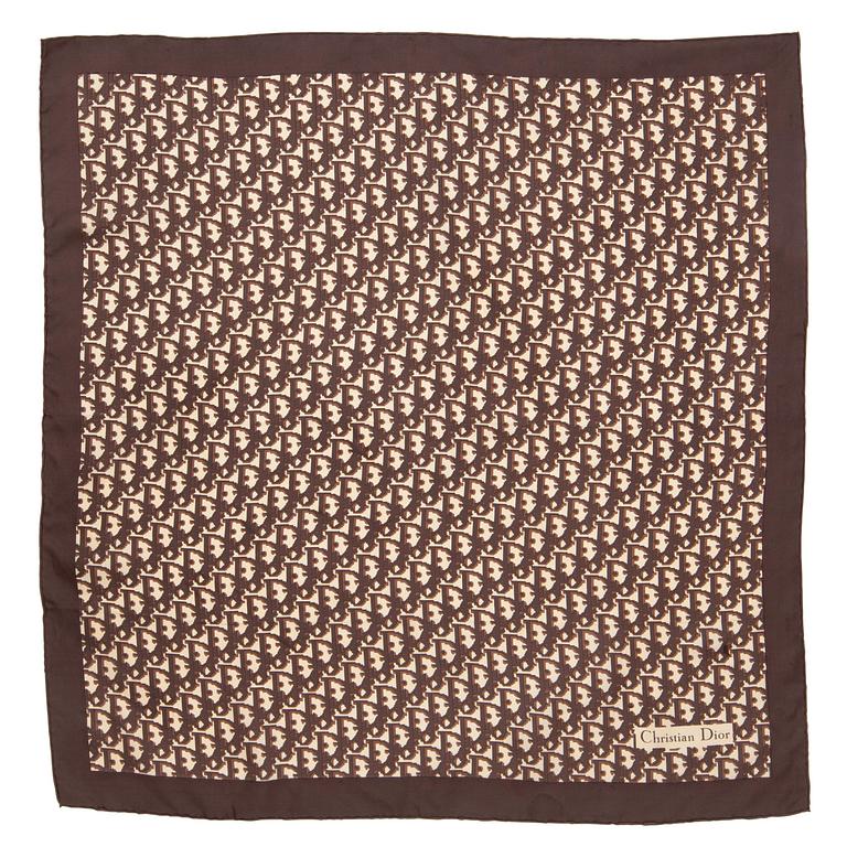 CHRISTIAN DIOR, a brown monogrammed silk scarf.