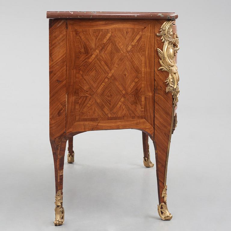 A Louis XV kingwood parquetry and ormolu-mounted commode in the manner of Jacques-Philippe Carel (Paris, 1723-1760).