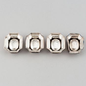 Four English early 18th century parcel-gilt silver salt-cellars, mark of Edward Wood, London 1727.