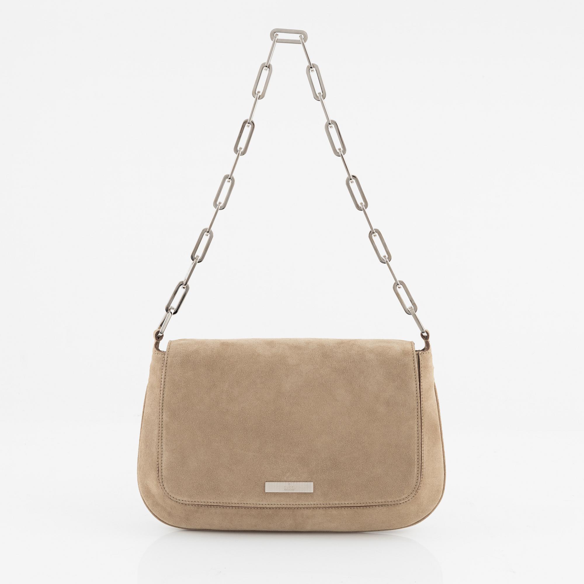 Gucci, a suede handbag.