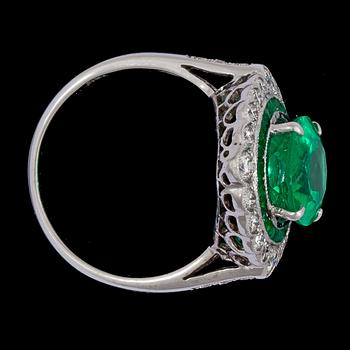 An emerald and brilliant cut diamond ring.