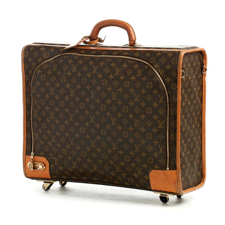 LOUIS VUITTON, a monogram canvas suitcase on wheels.