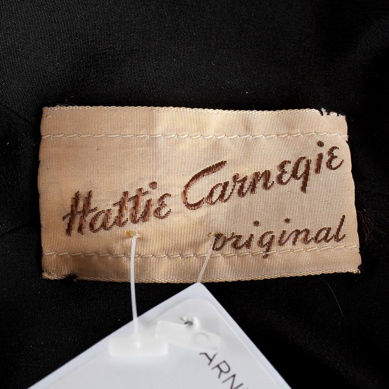 A black velvet evening jacket with pearls by Carnegie.