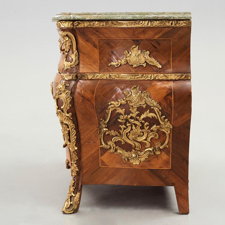 A Swedish Rococo chest of drawers by Christian Linning dated 1761 (master in Stockholm 1744-1779).