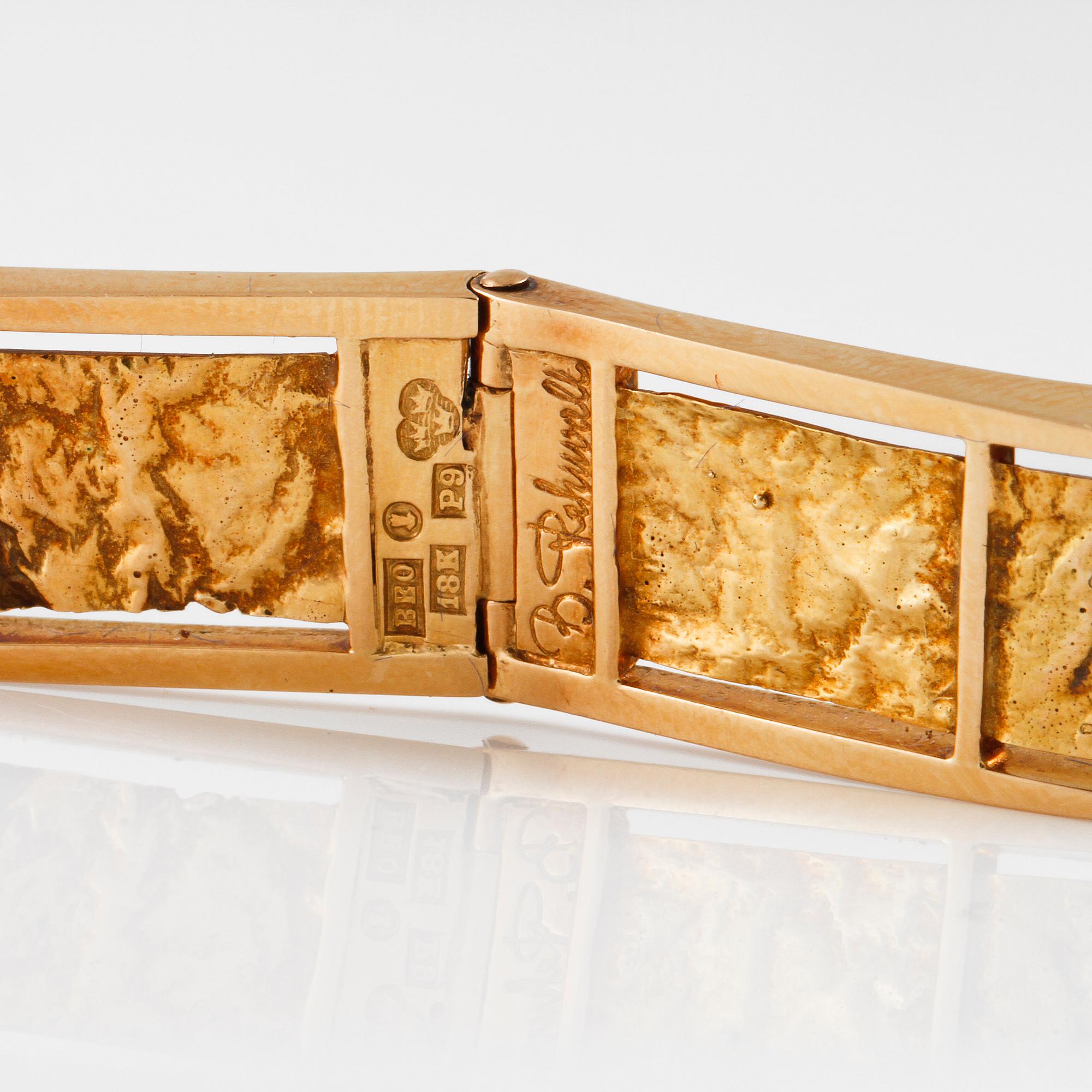 ARMRING, 18K guld med fasettslipad bergkristall, Bengt Rehnvall, Stockholm, 1965. Vikt 62,9 gram.