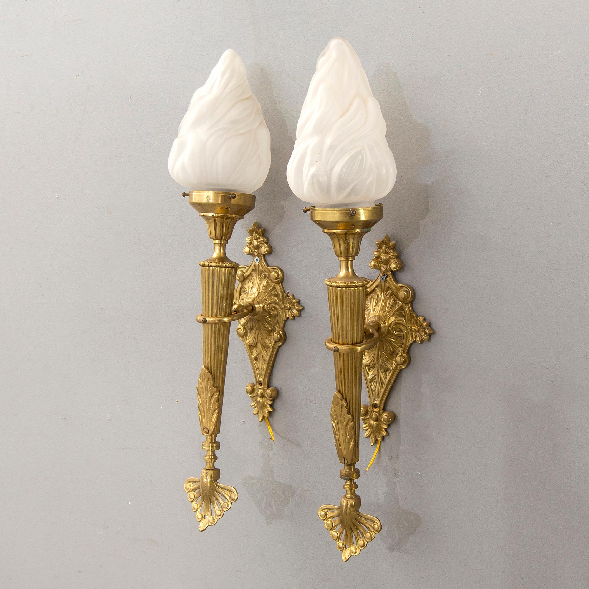 A pair of wall lamps later part of the 20th century.