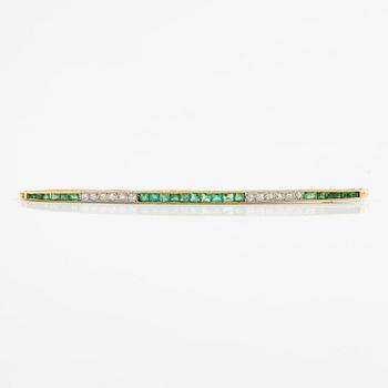 Brooch, longer model, gold with step-cut emeralds and old-cut diamonds, probably around the turn of the century 1900.