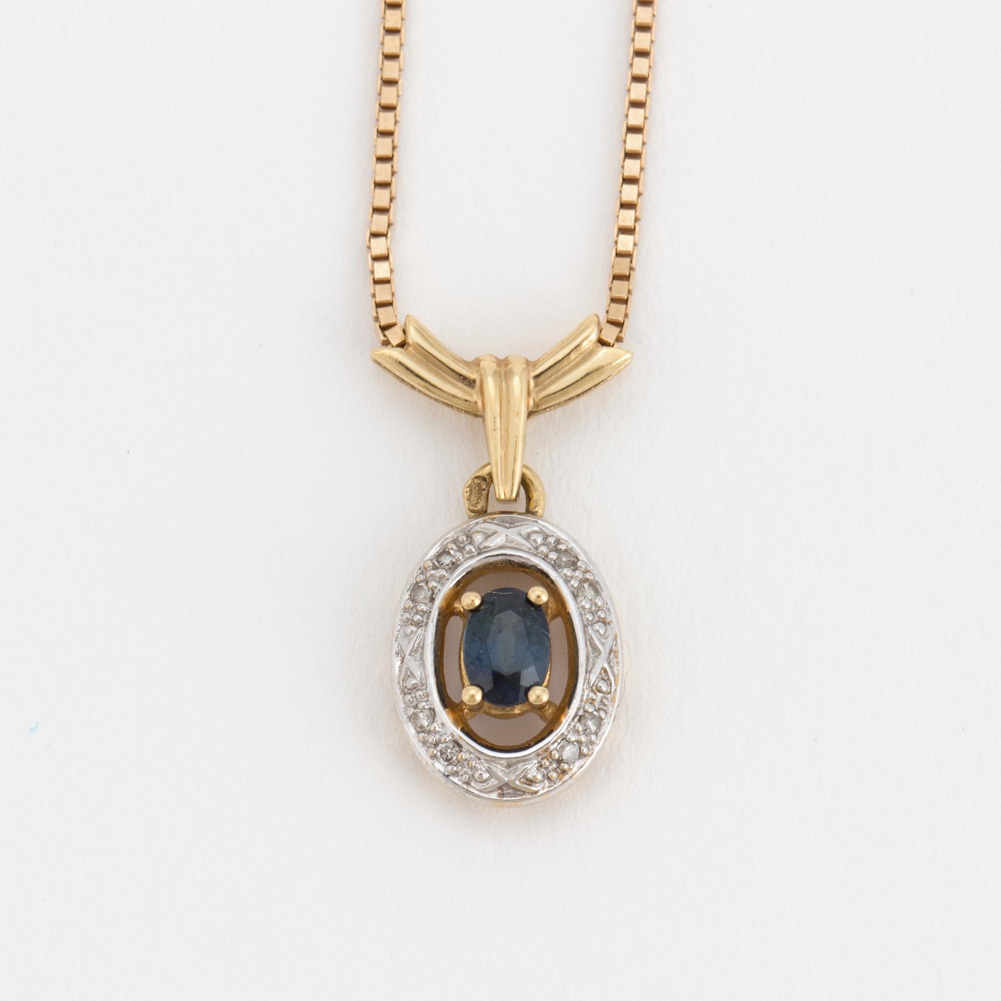 An 18K gold chain and pendant set with an oval, mixed-cut, synthetic sapphire surrounded by eight-cut diamonds.
