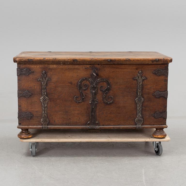 A large 17/17th century baroque oak chest with wrought iron fittings.