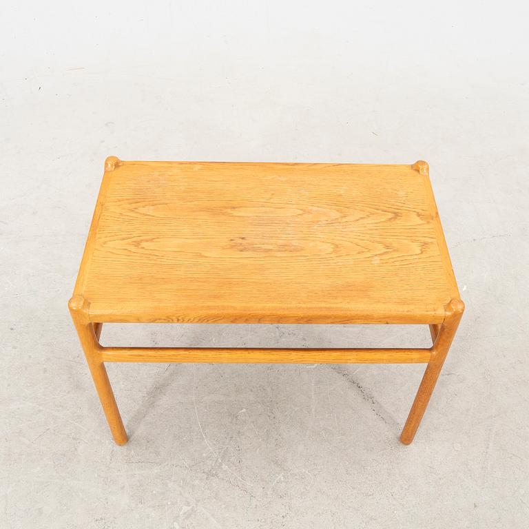 An oak side table by Johannes Andersen Denmark middle of the 20th century.
