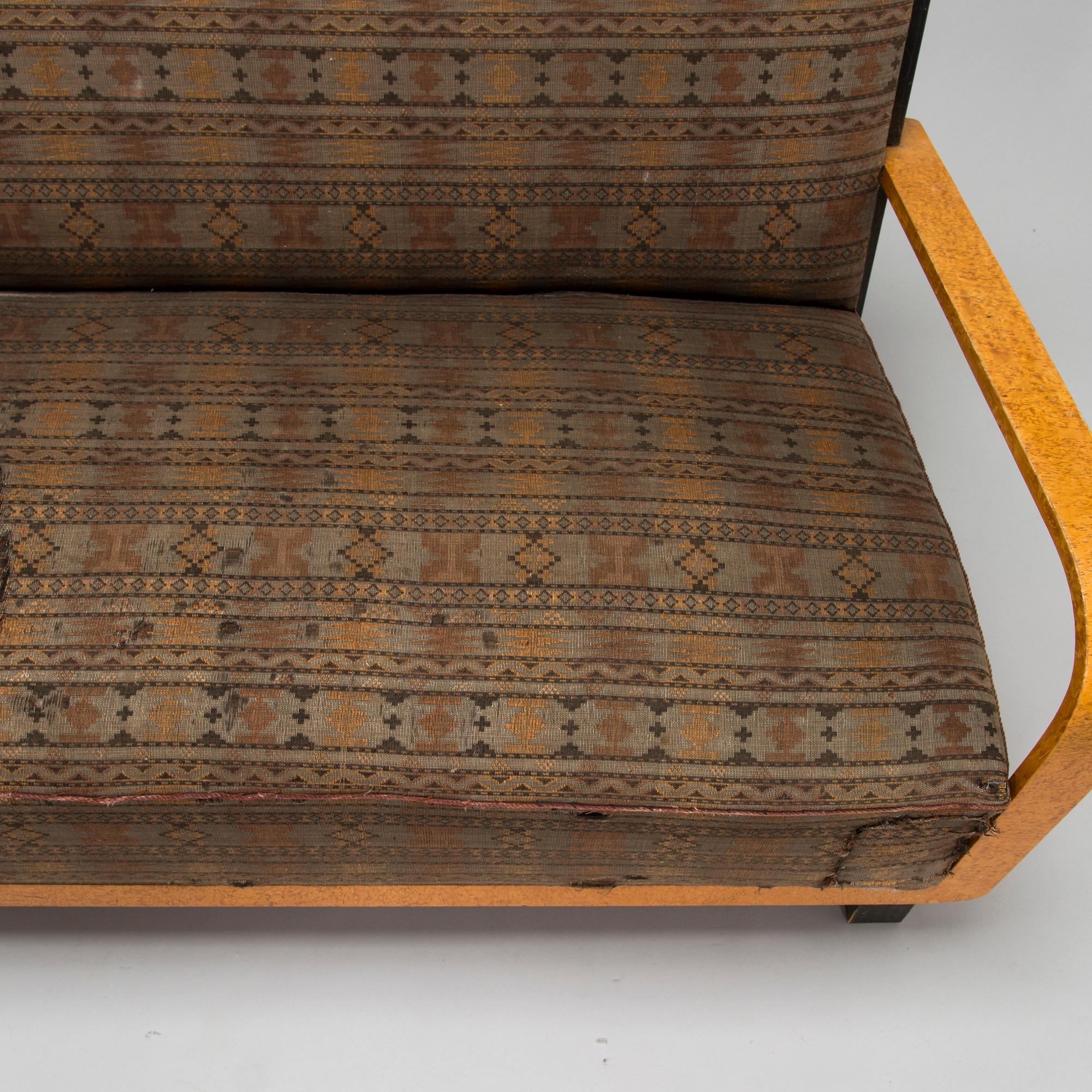 A  1920s Carelian birch veneered sofa.