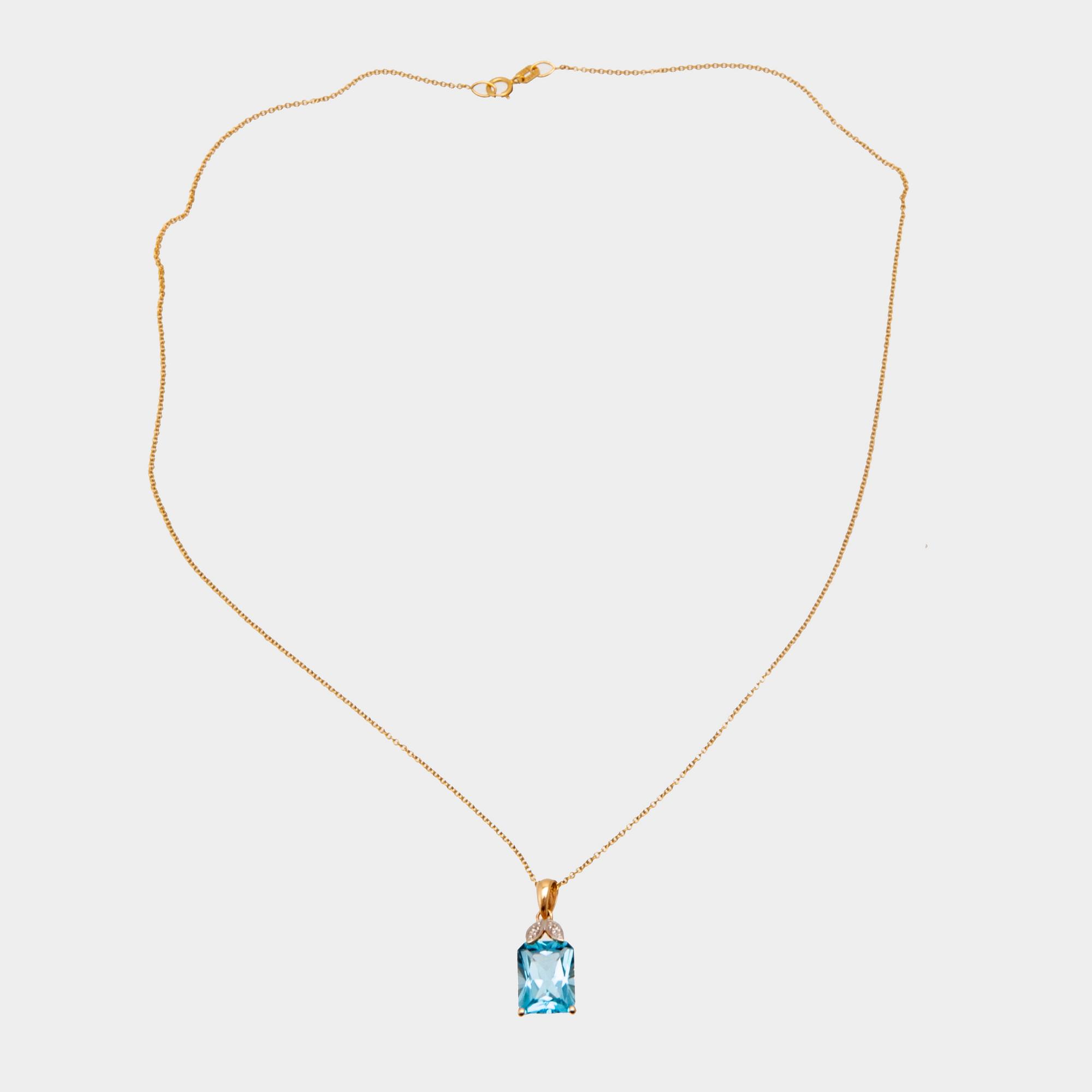 Halsband 14K guld med trappslipad blå topas och runda briljantslipade diamanter.