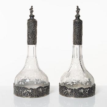 A pair of glass decanters with silver mounts, Swedish import marks, CG Hallberg, early 20th Century.