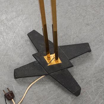 A 1950s brass and glass floor lamp.
