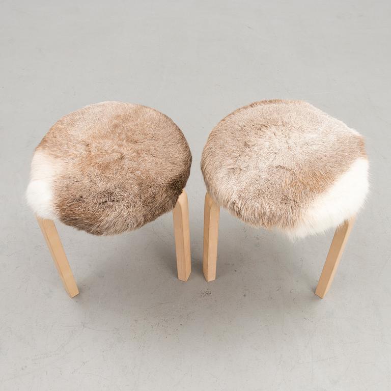 A pair of decorative stools, model 60 for Artek 2010. Upholstery design Ilse Crawford.