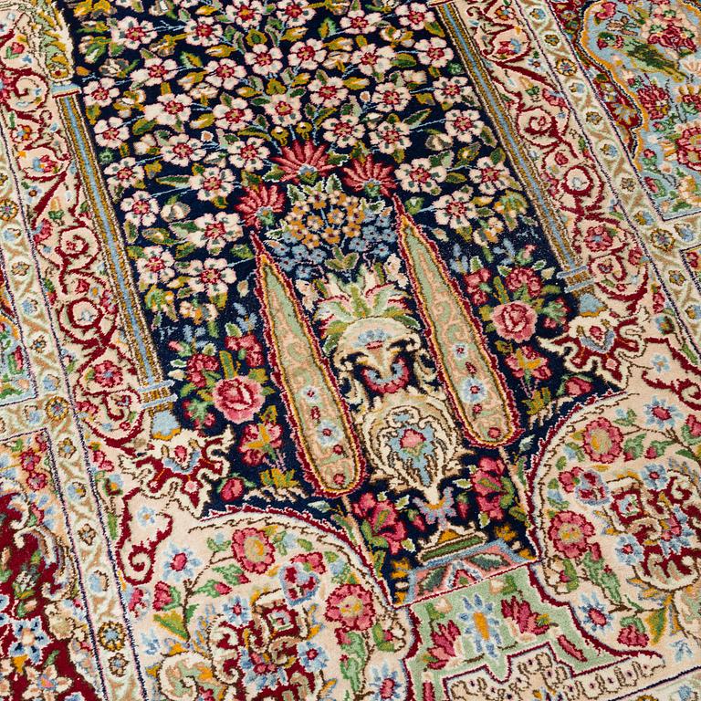 A CARPET, an old Kerman, ca 332,5-342 x 194-195,5 cm (as well as 1 cm flat weave at one end).