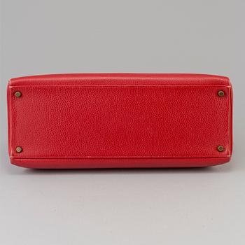 A red Epson "Kelly 40" bag by Hermès 1991.