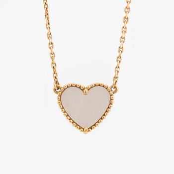 Van Cleef & Arpels, 18K gold and mother of pearl Alhambra heart necklace.