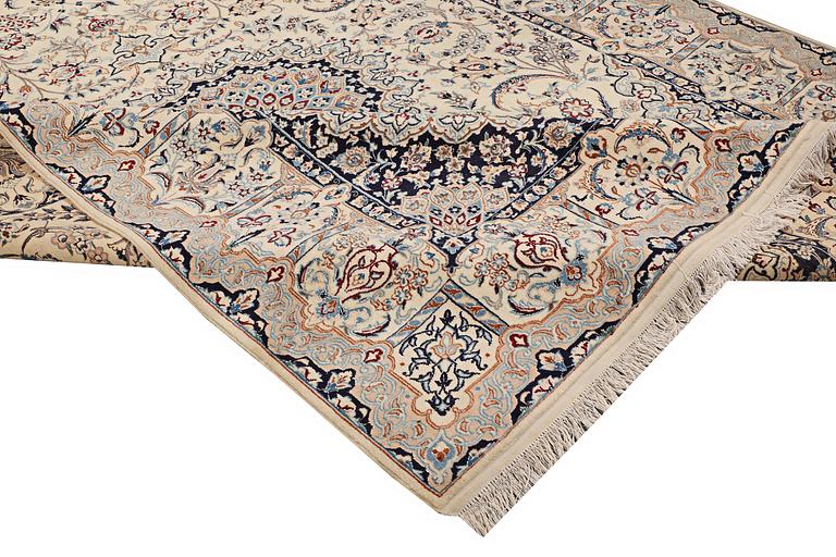 A carpet, Nain, part silk, approximately 348 x 258 cm.
