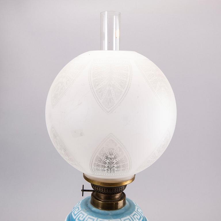 A glass paraffin lamp around 1900.