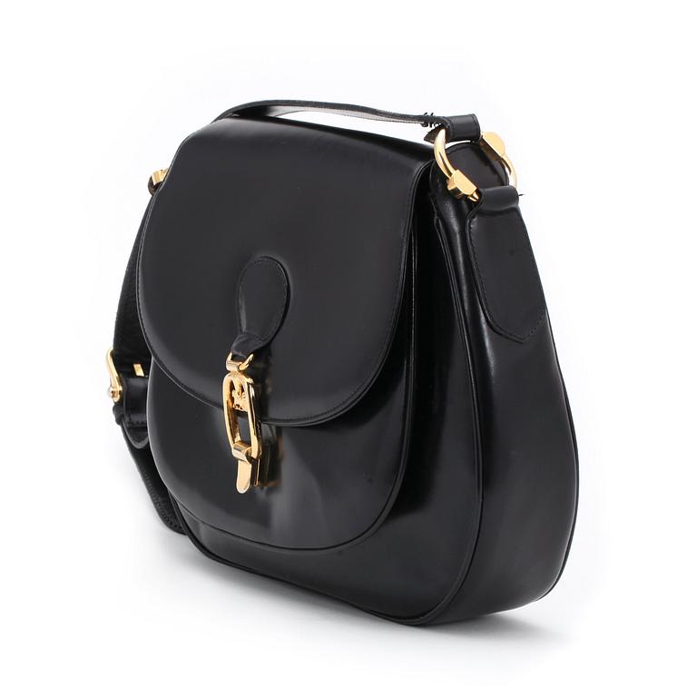 CÉLINE, a black leather shoulder bag.