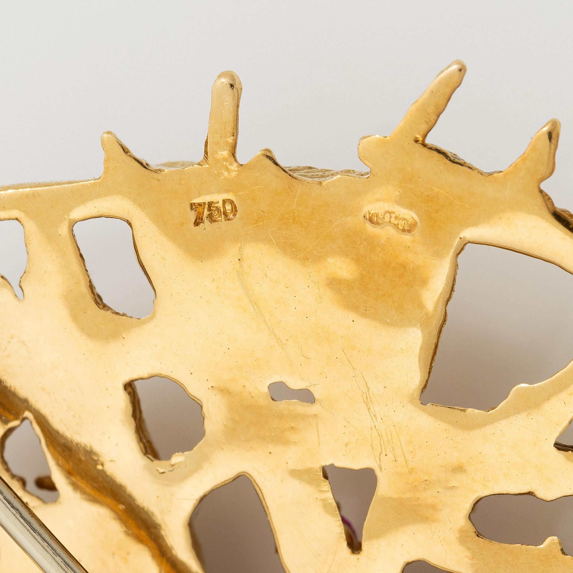 Brosch 18K guld med fasettslipade rubiner.