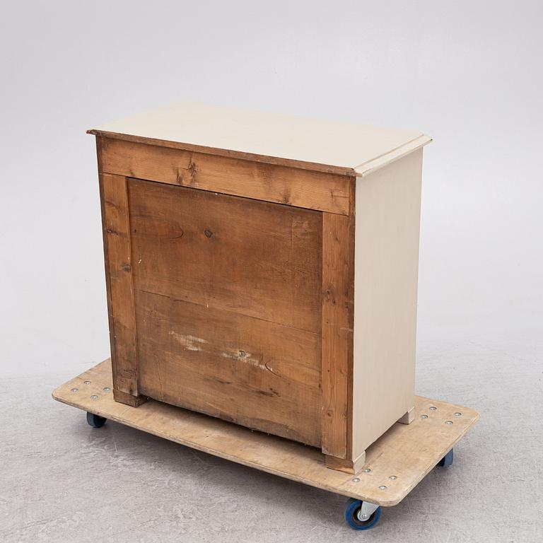 A chest of drawers, around 1900.