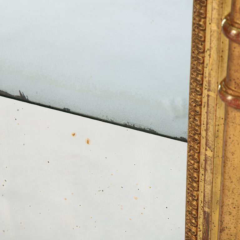 An Swedish Empire mirror, first half of the 19th century, attributed to Petter Gustaf Bylander, (Gothenburg 1802-59).