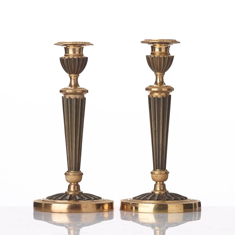 A pair of French Empire early 19th century candlesticks.