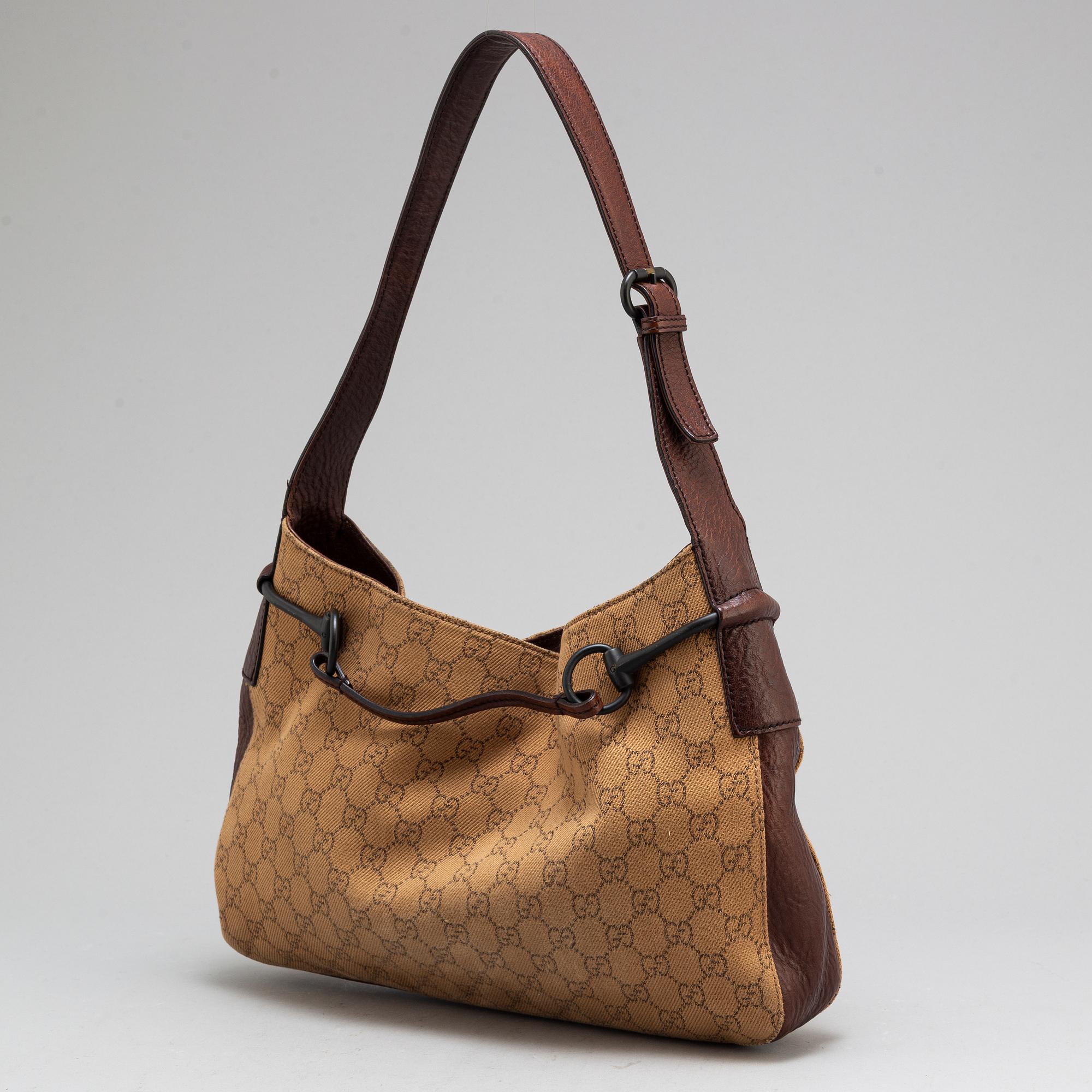 GUCCI, A canvas and leather bag.