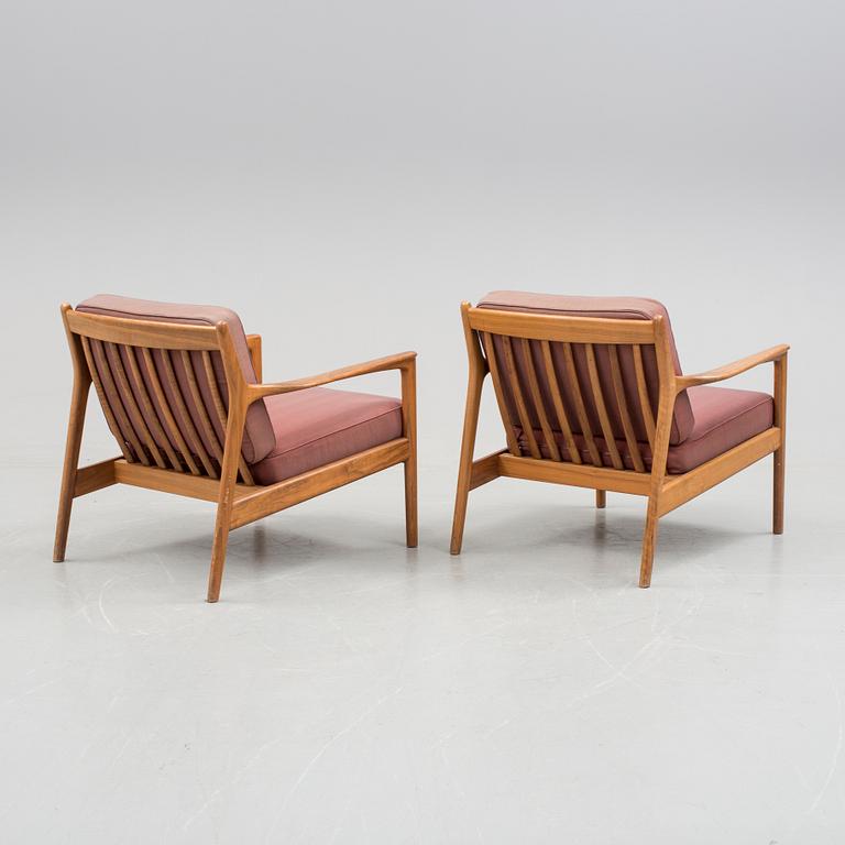 A pair of Folke Ohlsson "USA-75" armchairs for Dux, 1960s.