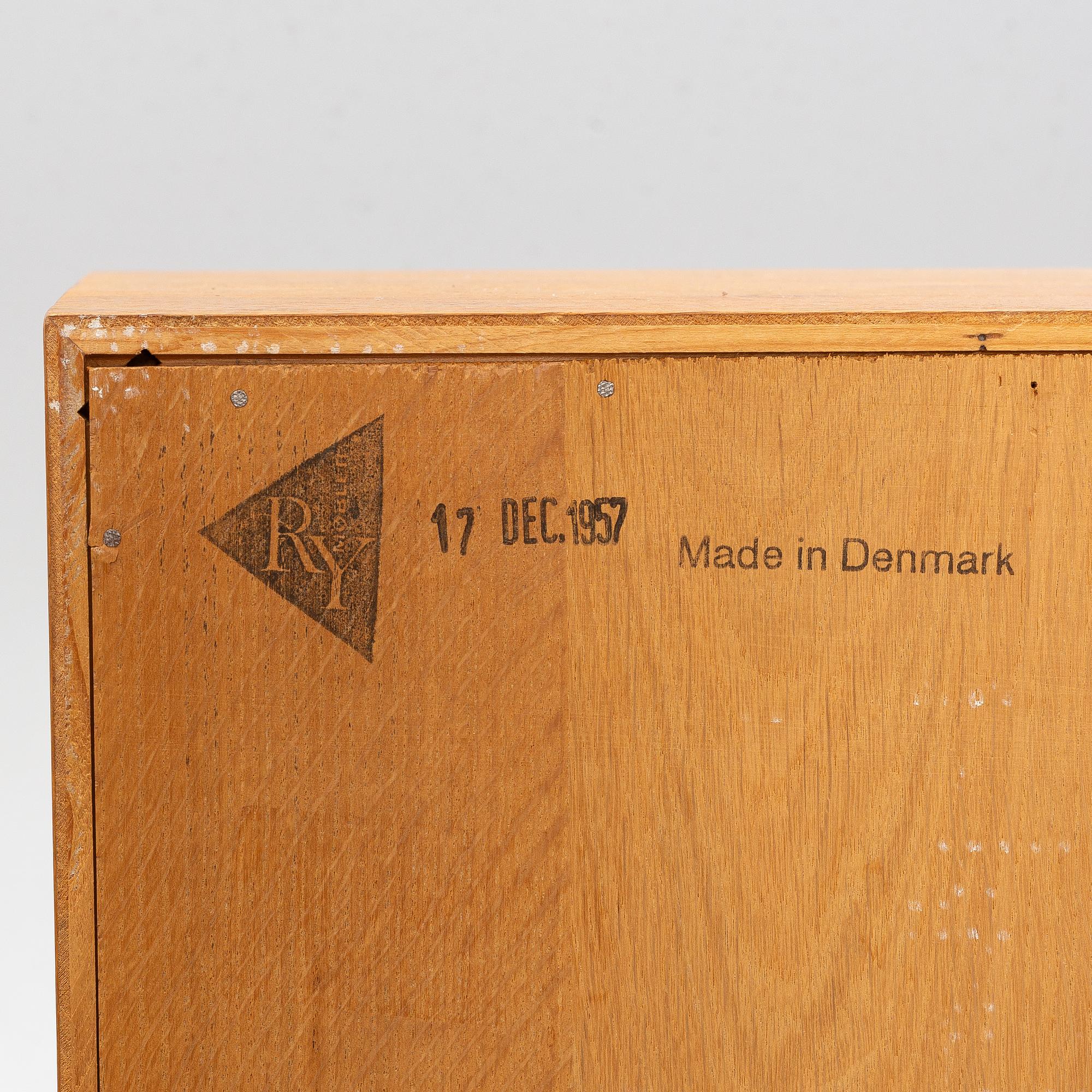 Hans J. Wegner, 2 cabinets and a shelf with a writing flap, Ry furniture, dated 1957.