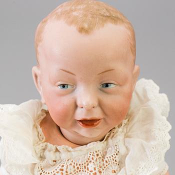 A bisque head character baby doll nr 100 by Kämmer & Reinhardt, Germany, 1909.