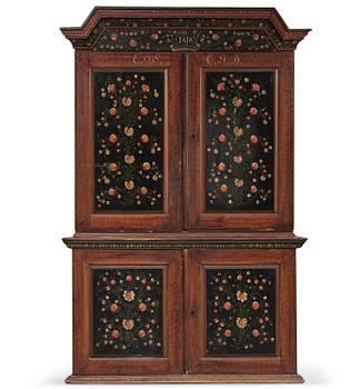 5. A Swedish polychrome painted folk art corner cabinet, dated 1818.