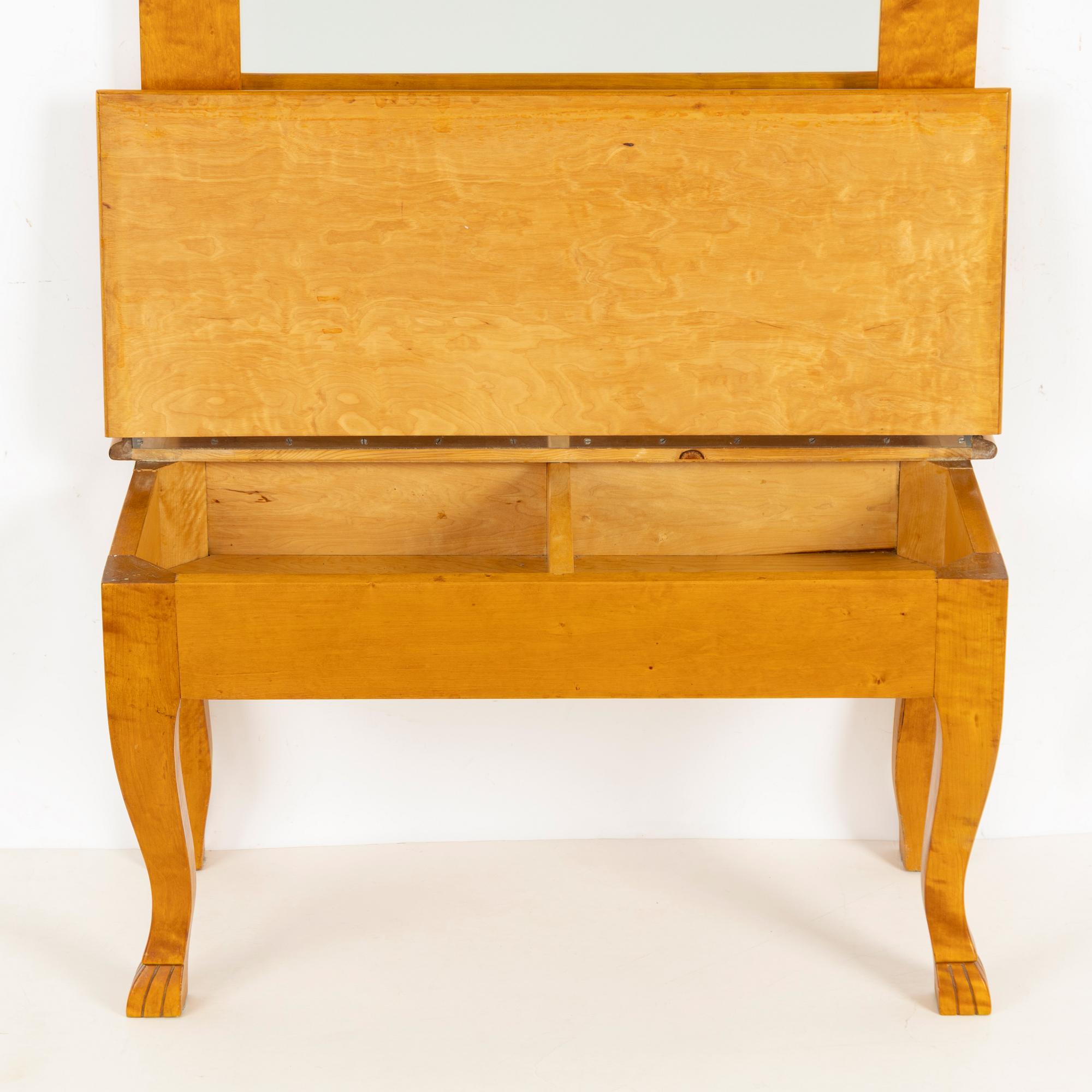 A mirror with console table, early 20th century.