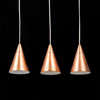 a set of three 1960's copper ceiling pendants.