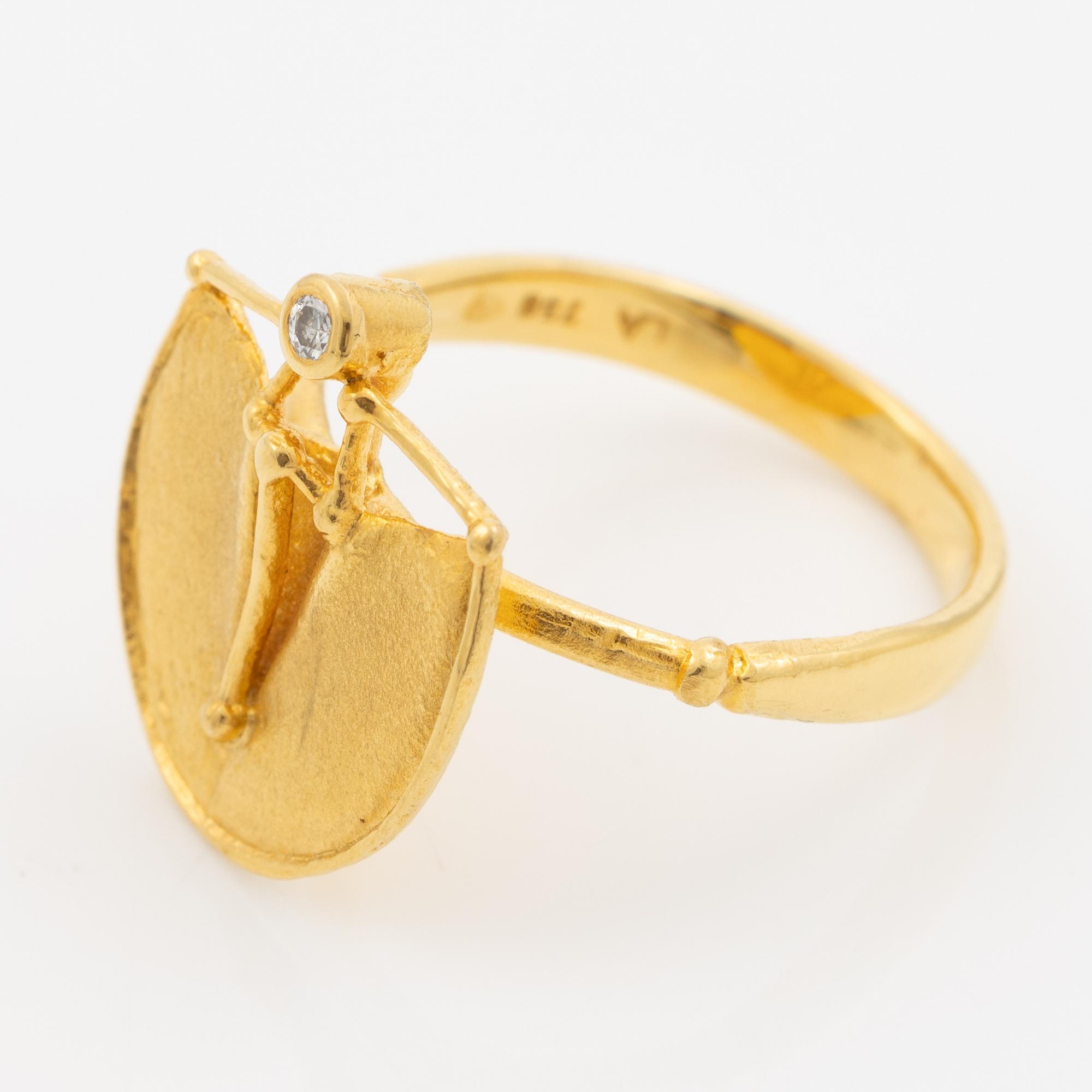 Ring, 18K guld med en rund briljantslipad diamant.