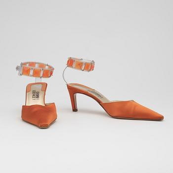 GIANNI VERSACE, a pair of orange lady's shoes and a handbag.