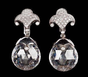 1000. A pair of faceted rock crystal and diamond earrings, tot. app. 2.60 cts, by Lisen Stibeck.