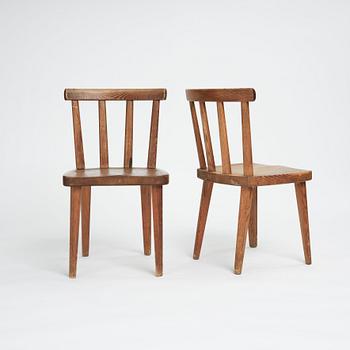 Axel Einar Hjorth, a set of four stained pine "Utö" chairs, Nordiska Kompaniet, Sweden 1930s.