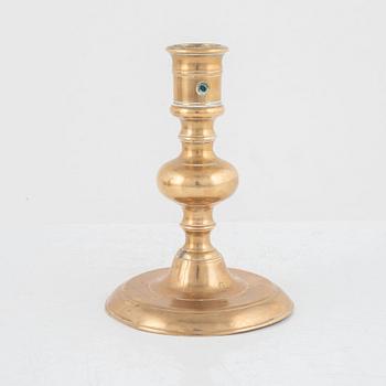 A Baroque brass candlestick, 17th century.