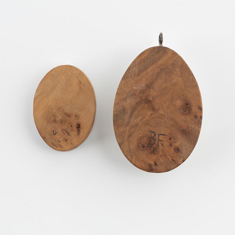 Two birch and reindeer pendants by Bertil Fällman, one signed.