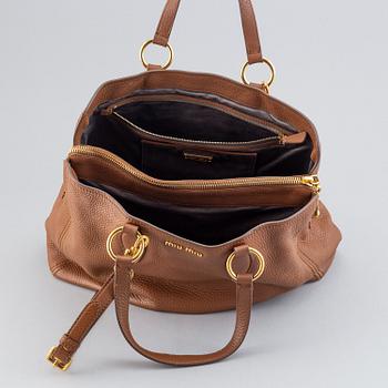 Miu Miu, a leather bag.