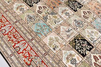 An oriental silk carpet, approx. 376 x 274 cm.