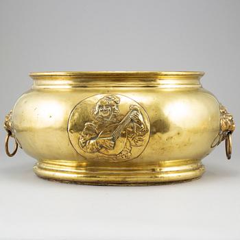 A 19th century brass champagne cooler.