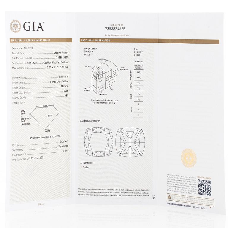 Ring, rosett, 18K vitguld, med gul kuddslipad diamant samt klara briljantslipade diamanter.